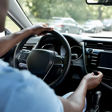 Person driving a car