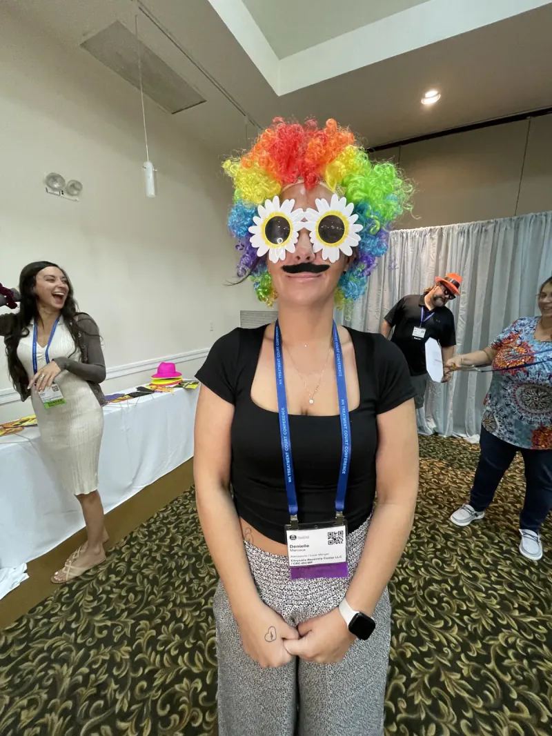 Denielle making the Chrysalis Recovery Center team laugh