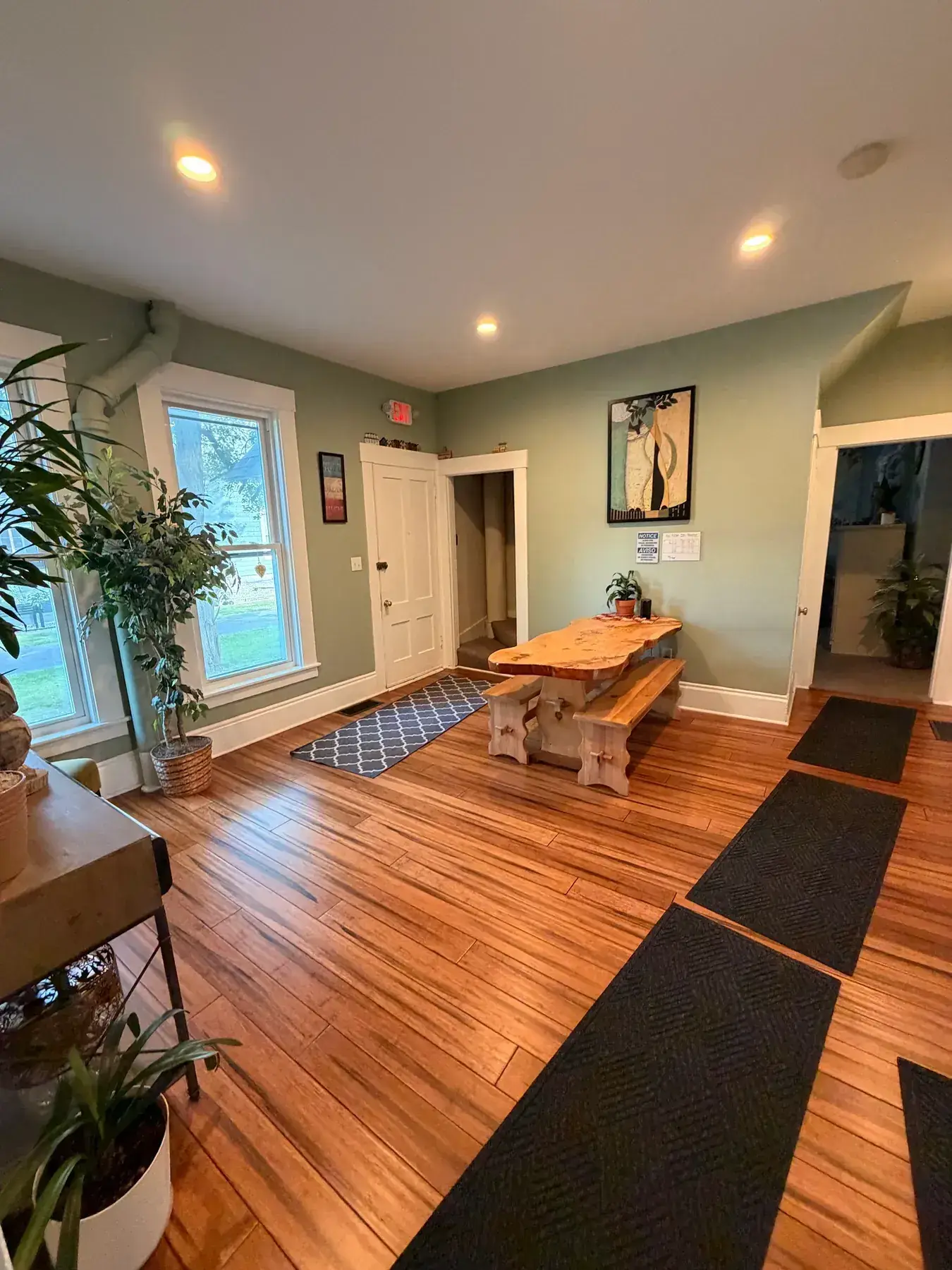 Dining room with a table, chairs, and warm wood floors at the Concord, NH office