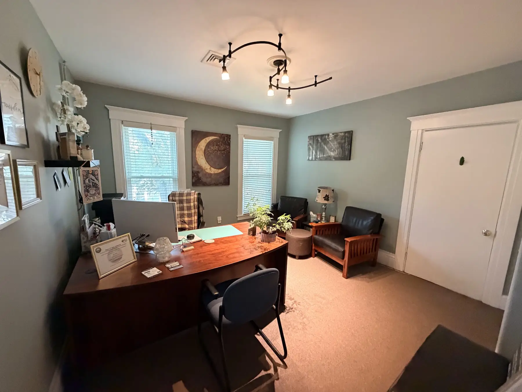 Second view of Alyse’s office with a desk and seating at the Concord, NH office