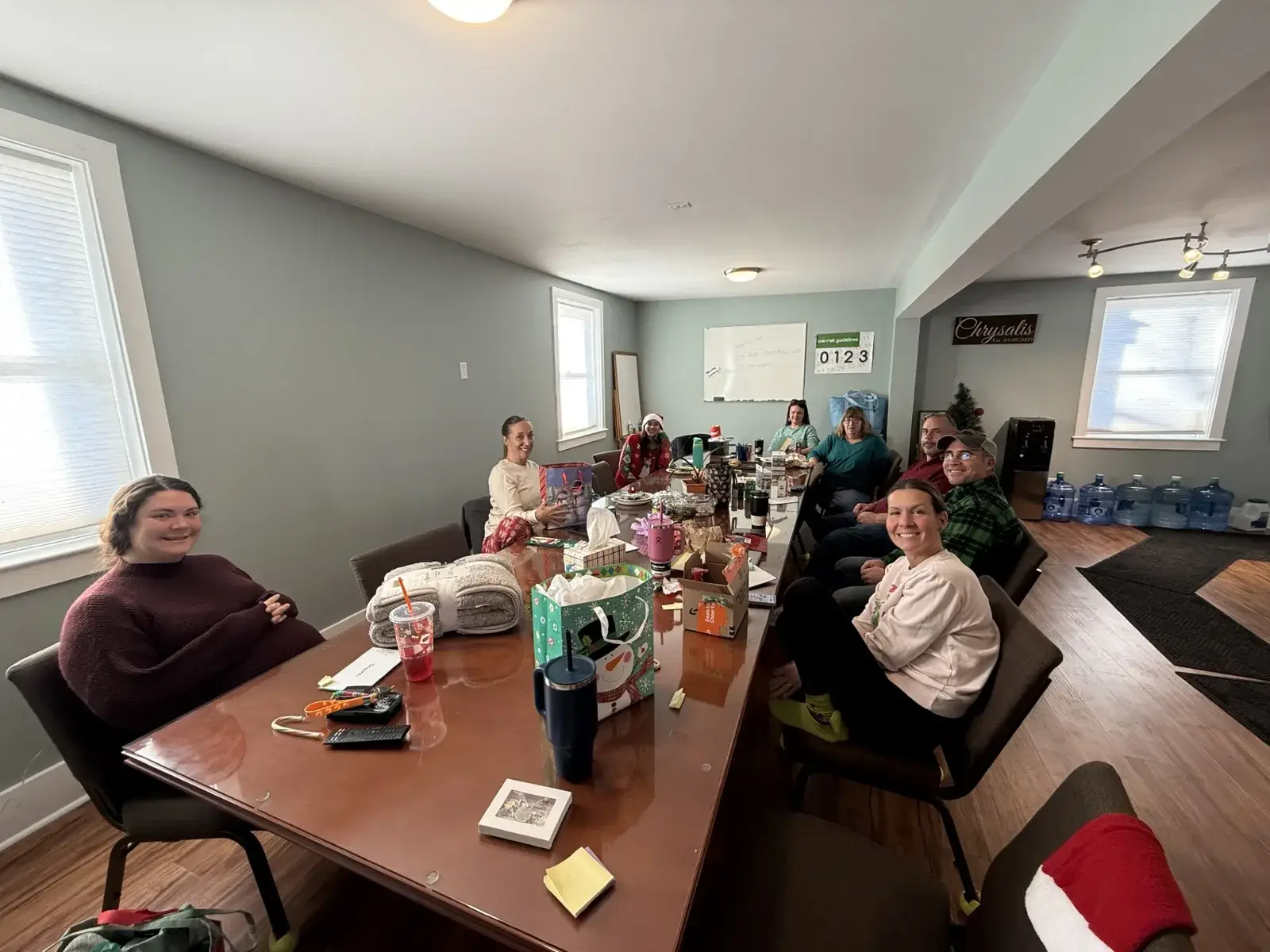 Chrysalis Recovery Center staff gathered around a table for a holiday activity