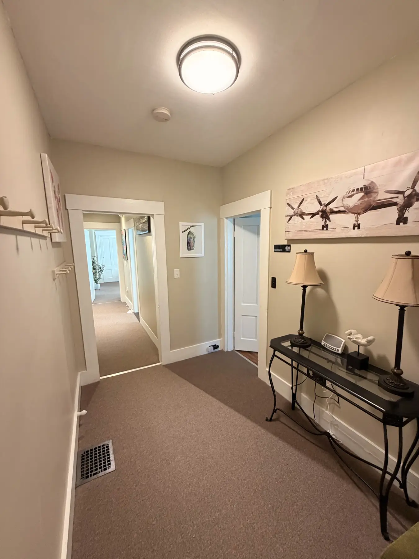 Upstairs hallway leading toward the conference room and restrooms at the Concord, NH office