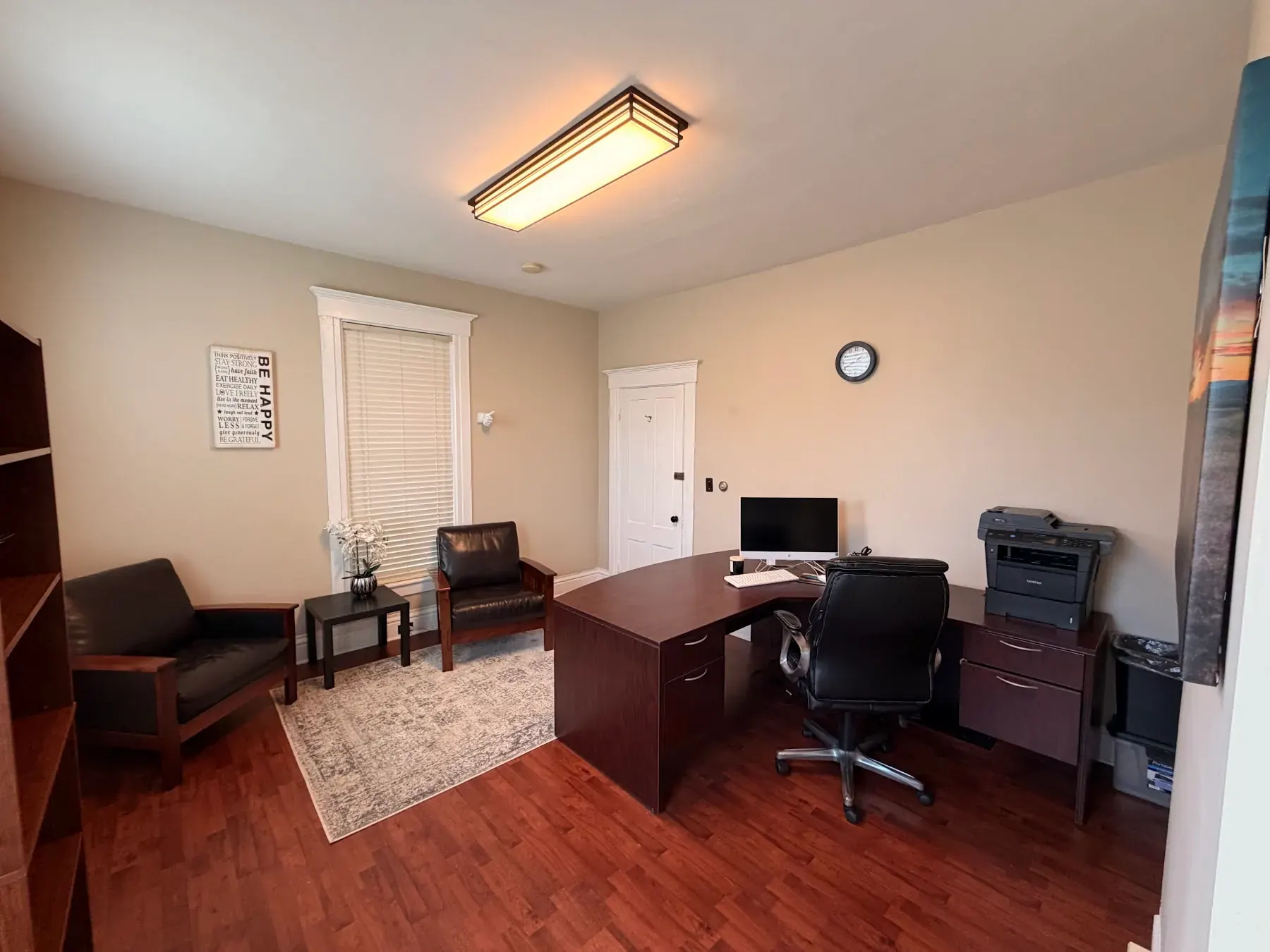 Intake office with a desk and two chairs at the Concord, NH office