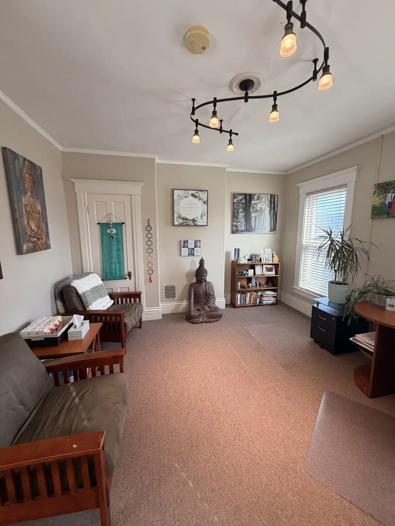 Second view of Sarah’s office with a desk and seating at the Concord, NH office