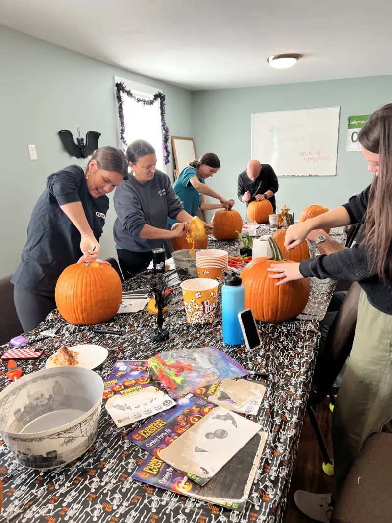 Chrysalis Recovery Center team carving pumpkins in 2025